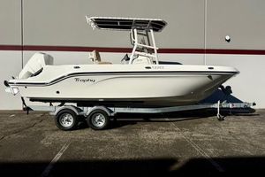 Bayliner Trophy T22CC 2026 Bayliner Trophy T22CC boat on trailer, side view, parked outdoors.
