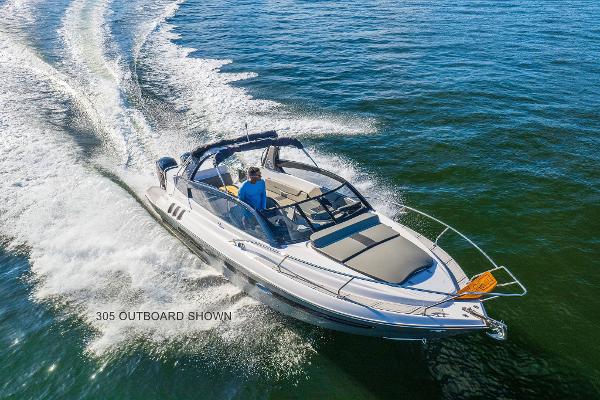 Hanover 305 2025 Hanover 305 boat cruising on open water, showcasing sleek design and performance.