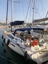 Jeanneau 53 2011 Jeanneau 53 sailboat docked in marina, featuring sleek design and spacious deck.