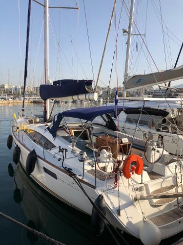 Jeanneau 53 2011 Jeanneau 53 sailboat docked in marina, featuring sleek design and spacious deck.