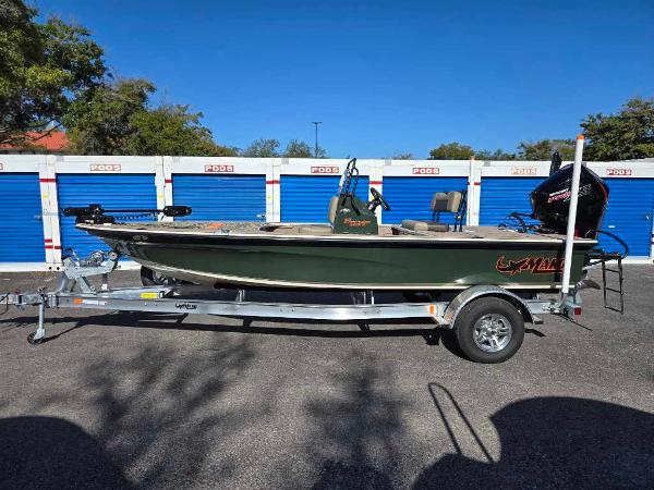 Mako 18 Pro Skiff Backwater Edition 2025 Mako 18 Pro Skiff Backwater Edition on trailer, parked near storage units.