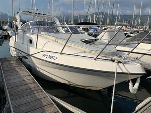 Mano Marine 22.52 Cabin 2005 Mano Marine 22.52 Cabin boat docked in marina, surrounded by other vessels.