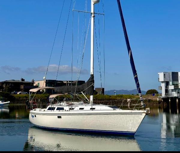 Catalina 42 Sailboat Catalina 42, 1993 model, anchored in calm waters with clear blue sky.