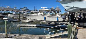 Grady-White Canyon 326 2023 Grady-White Canyon 326 in marina on a hoist lift.