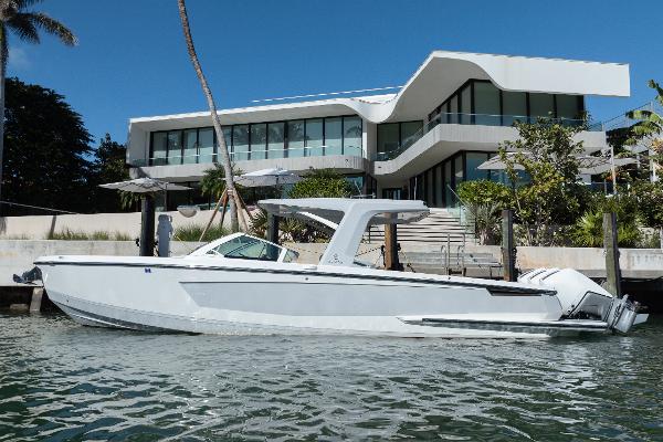 Aviara AV36 OB 2023 Aviara AV36 OB boat docked near modern waterfront home.