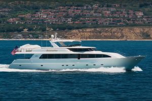 Westport 112 Luxury Westport 112 yacht cruising near scenic coastline, 2000 model.