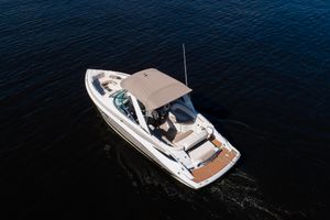 Crownline 285 SS 2017 Crownline 285 SS boat cruising on calm water, aerial view.