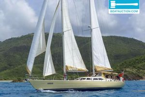 Ocean 80 Sailing yacht "Arrow" on blue ocean near lush green hills, Ocean 80 model, 1995.