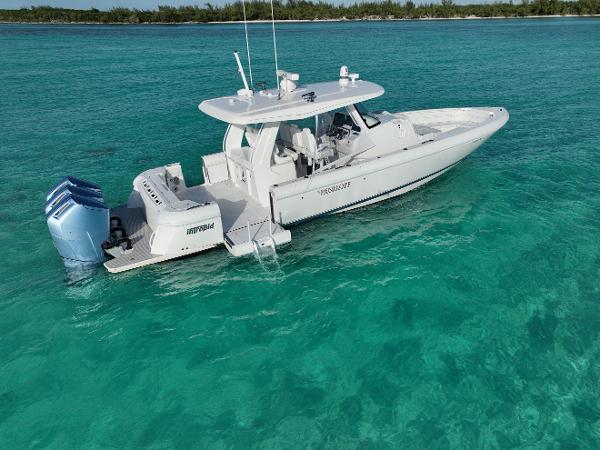 Intrepid 427 Nomad SE 2023 Intrepid 427 Nomad SE boat on clear turquoise water.