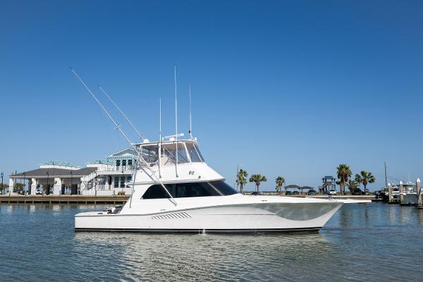 Viking 47 Convertible 1999 Viking 47 Convertible yacht on calm water with clear blue sky.