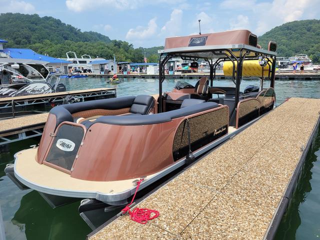 Aloha 30' Paradise Sundeck 2025 Aloha 30' Paradise Sundeck boat docked at a scenic marina.