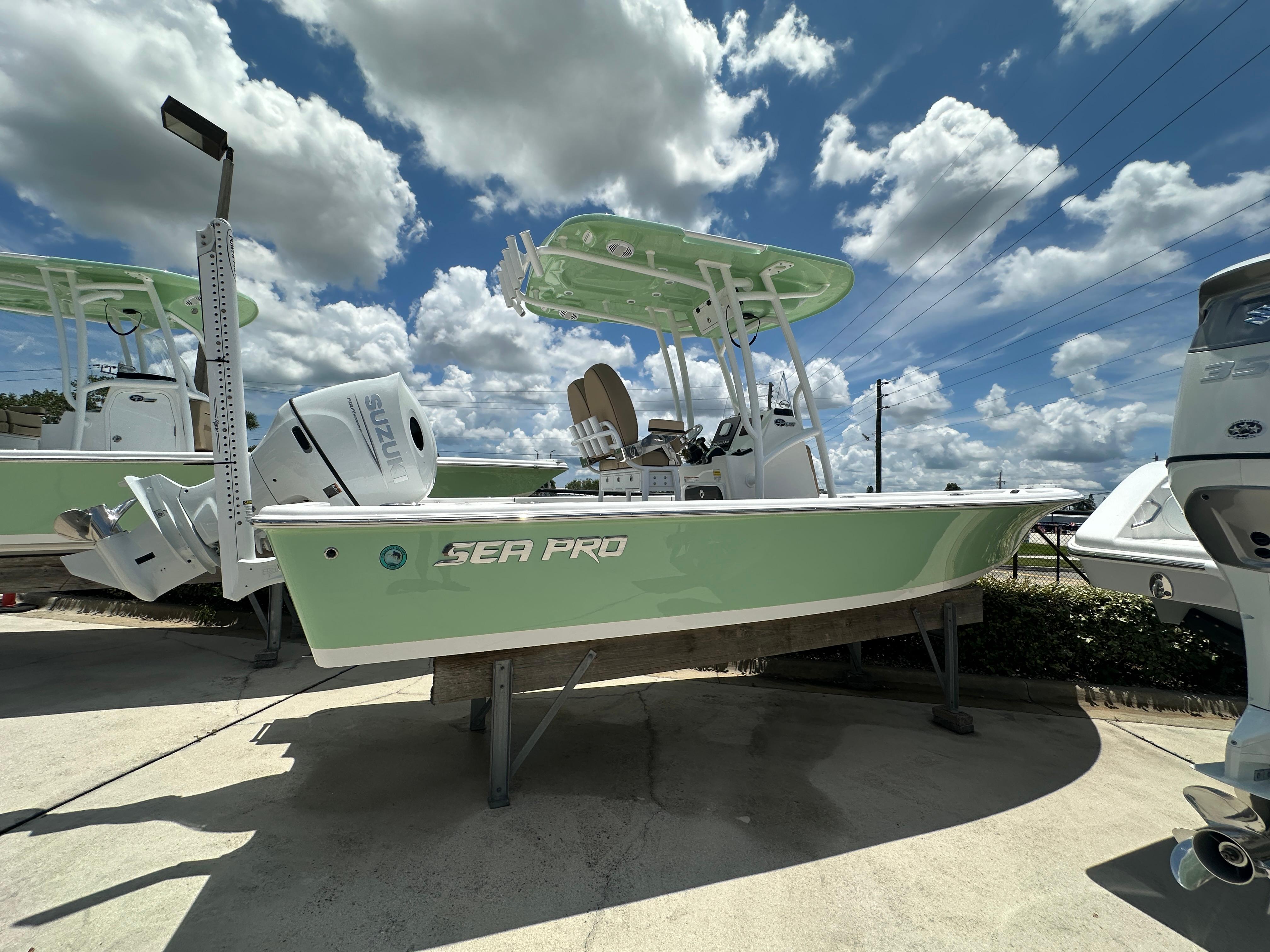 Sea Pro 230 Bay 2026 Sea Pro 230 Bay boat displayed outdoors under a cloudy sky.