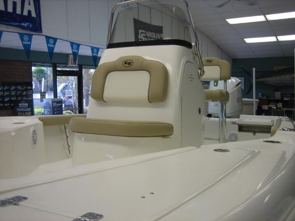 Key West 230 BR 2024 Key West 230 BR boat interior with beige seating in showroom.