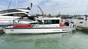 Axopar 28 Cabin Brabus Line 2023 Axopar 28 Cabin Brabus Line boat docked in marina.