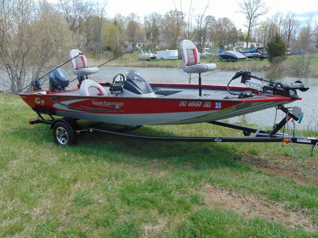 G3 Sportsman 17 2018 G3 Sportsman 17 fishing boat on trailer by a lake.