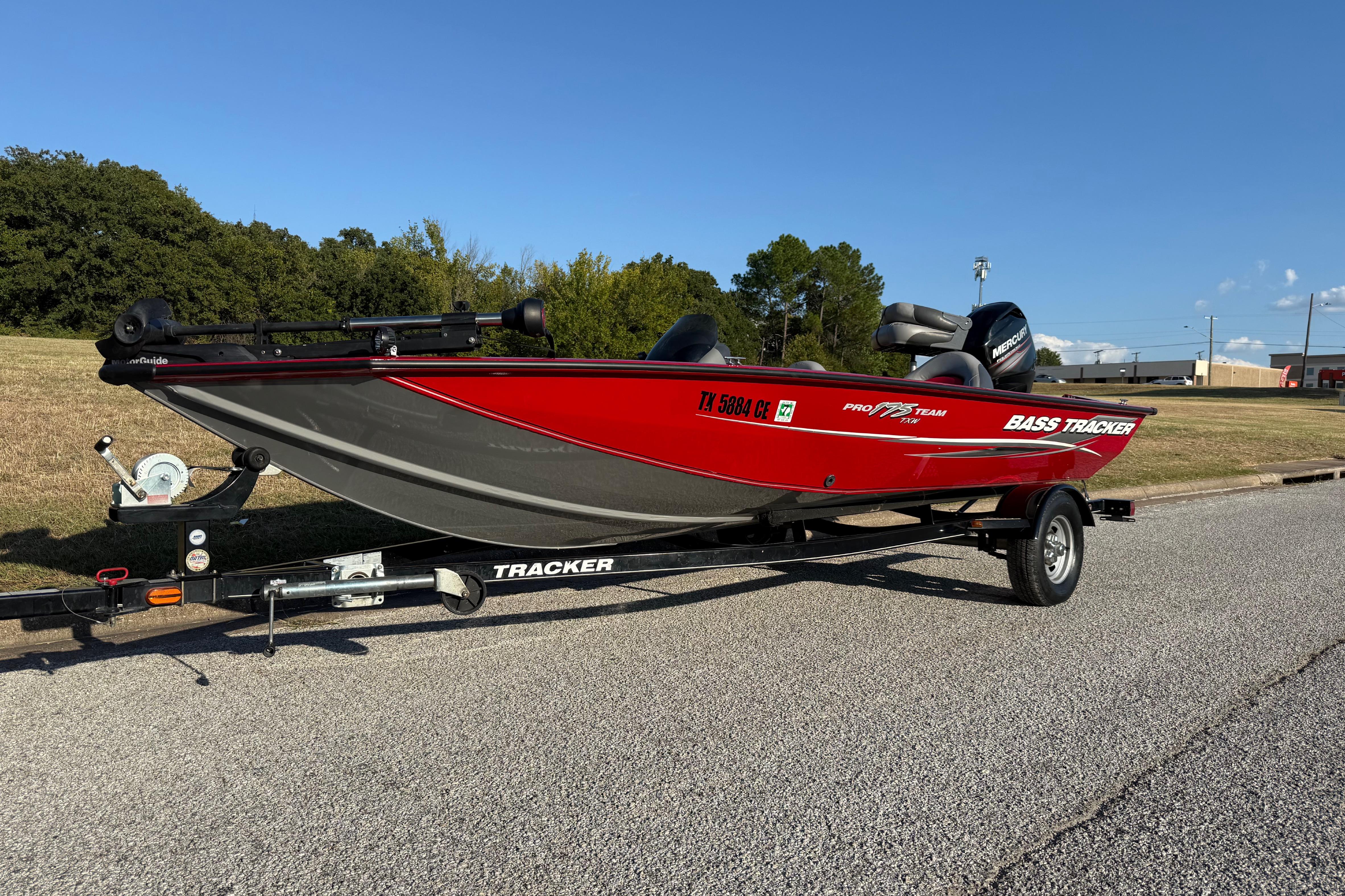 Bass Tracker Pro Team 175 2014 Bass Tracker Pro Team 175 boat on trailer, parked on roadside.