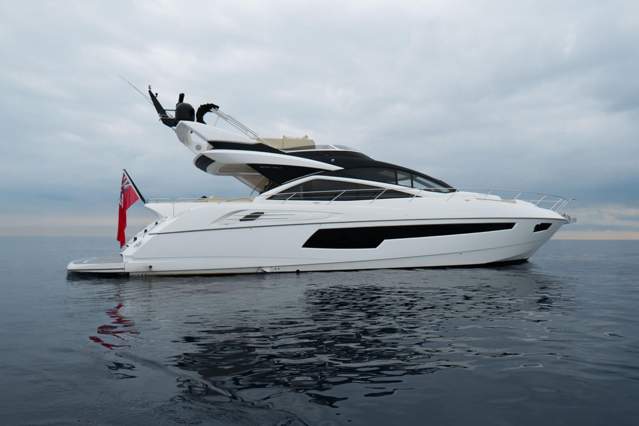 Sunseeker 68 Sport Yacht 2016 Sunseeker 68 Sport Yacht on calm waters under cloudy sky.