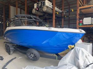 Yamaha Boats AR250 2025 Yamaha Boats AR250 in storage, vibrant blue hull on trailer.