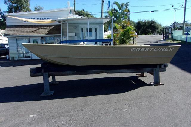 Crestliner 1448M CR Jon 2024 Crestliner 1448M CR Jon boat displayed outdoors on a stand.