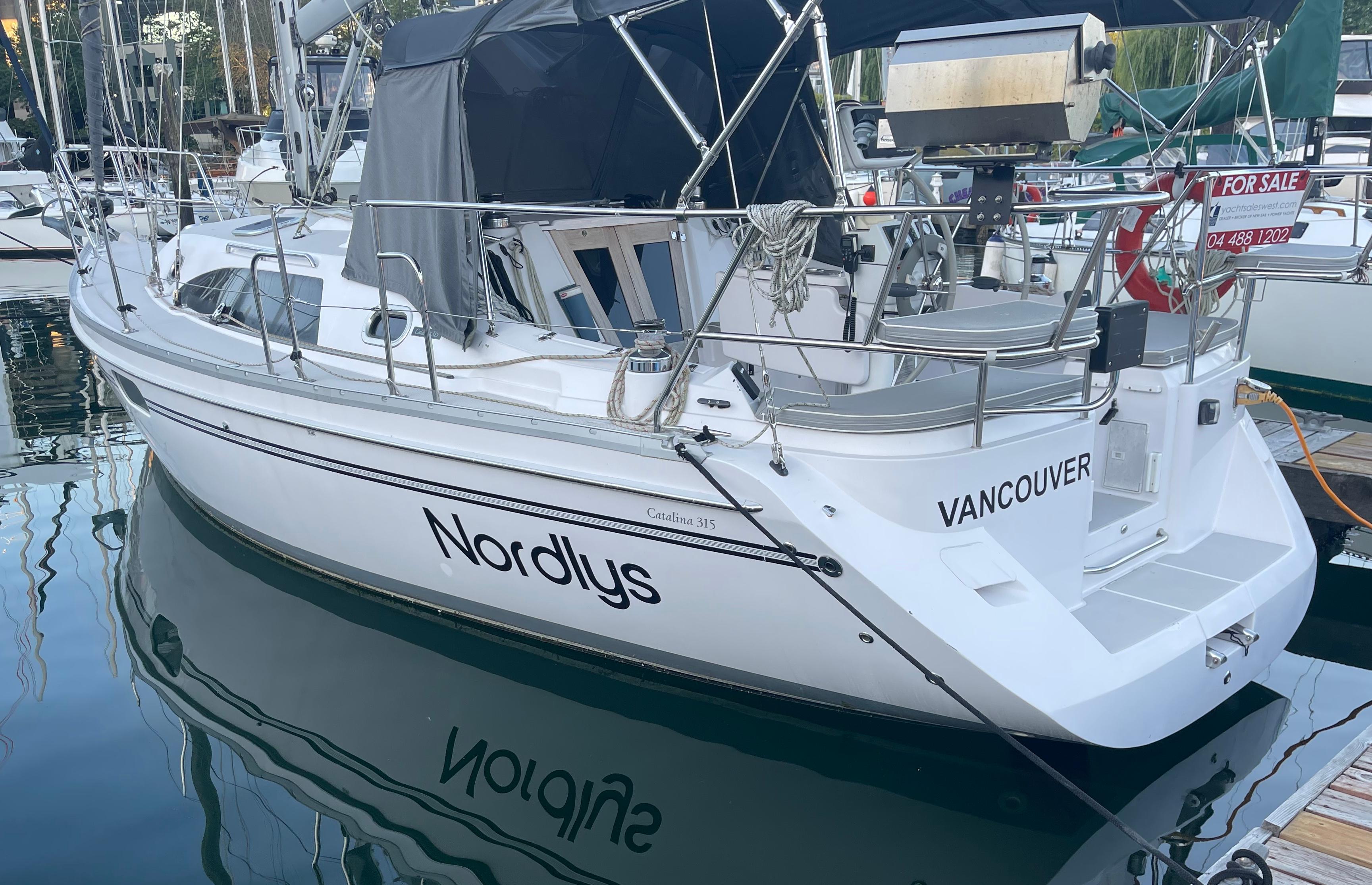 Catalina 315 2018 Catalina 315 sailboat named Nordlys docked in Vancouver marina.