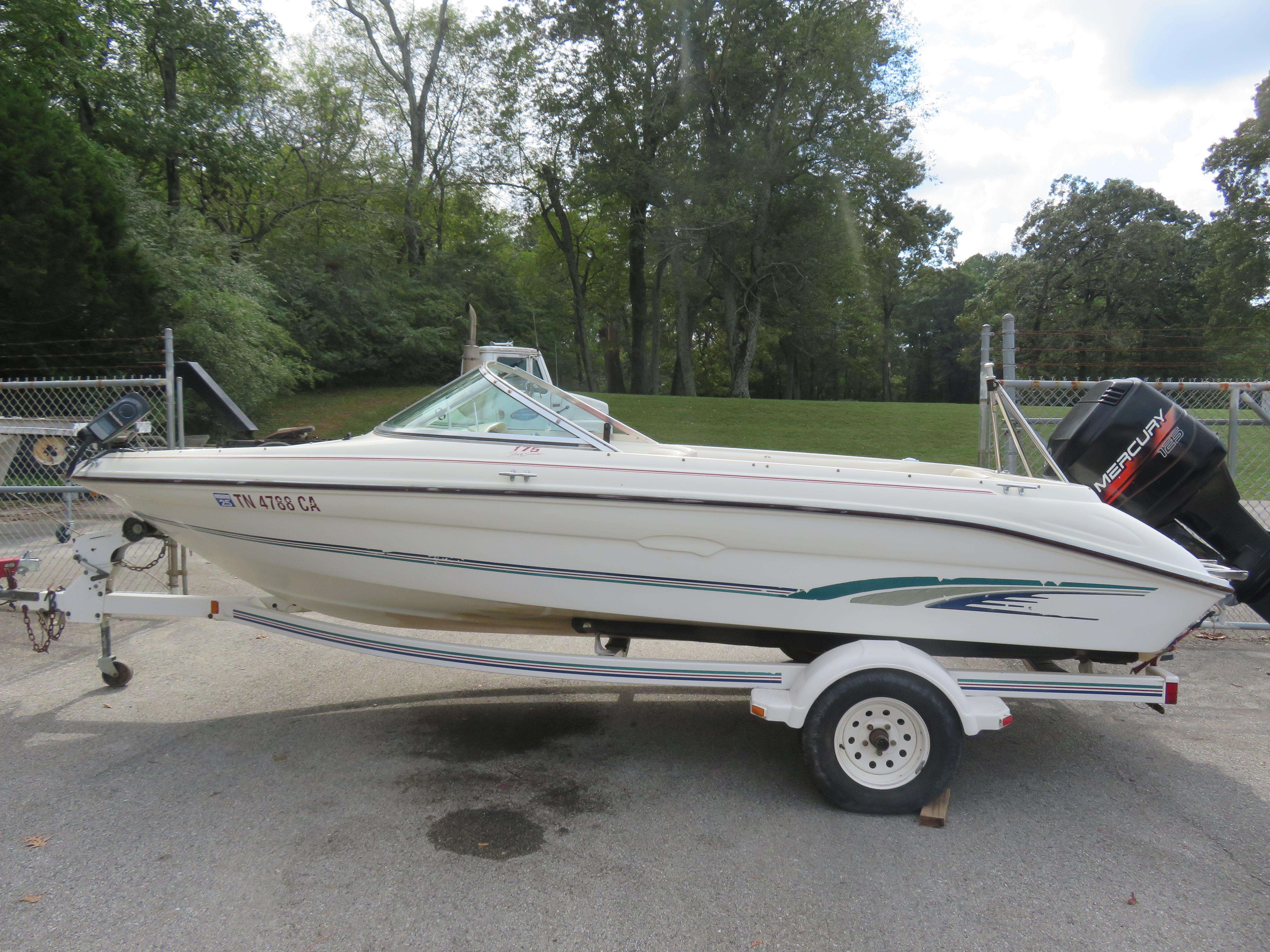 Sea Ray 175 BROB 1996 Sea Ray 175 BROB boat on trailer, parked outdoors with trees in background.