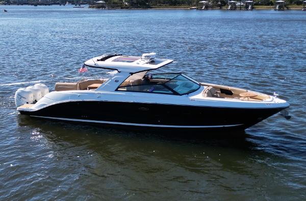 Sea Ray SLX 400 Outboard 2021 Sea Ray SLX 400 OB boat on calm water, side view.