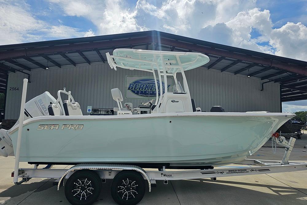 Sea Pro 225 Sandbar 2026 Sea Pro 225 Sandbar boat on trailer, parked outdoors under a cloudy sky.