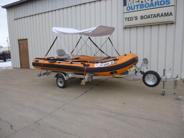 Sea Eagle 14' INFLATABLE 2015 Sea Eagle 14' inflatable boat with canopy on trailer outside Ted's Boatarama.