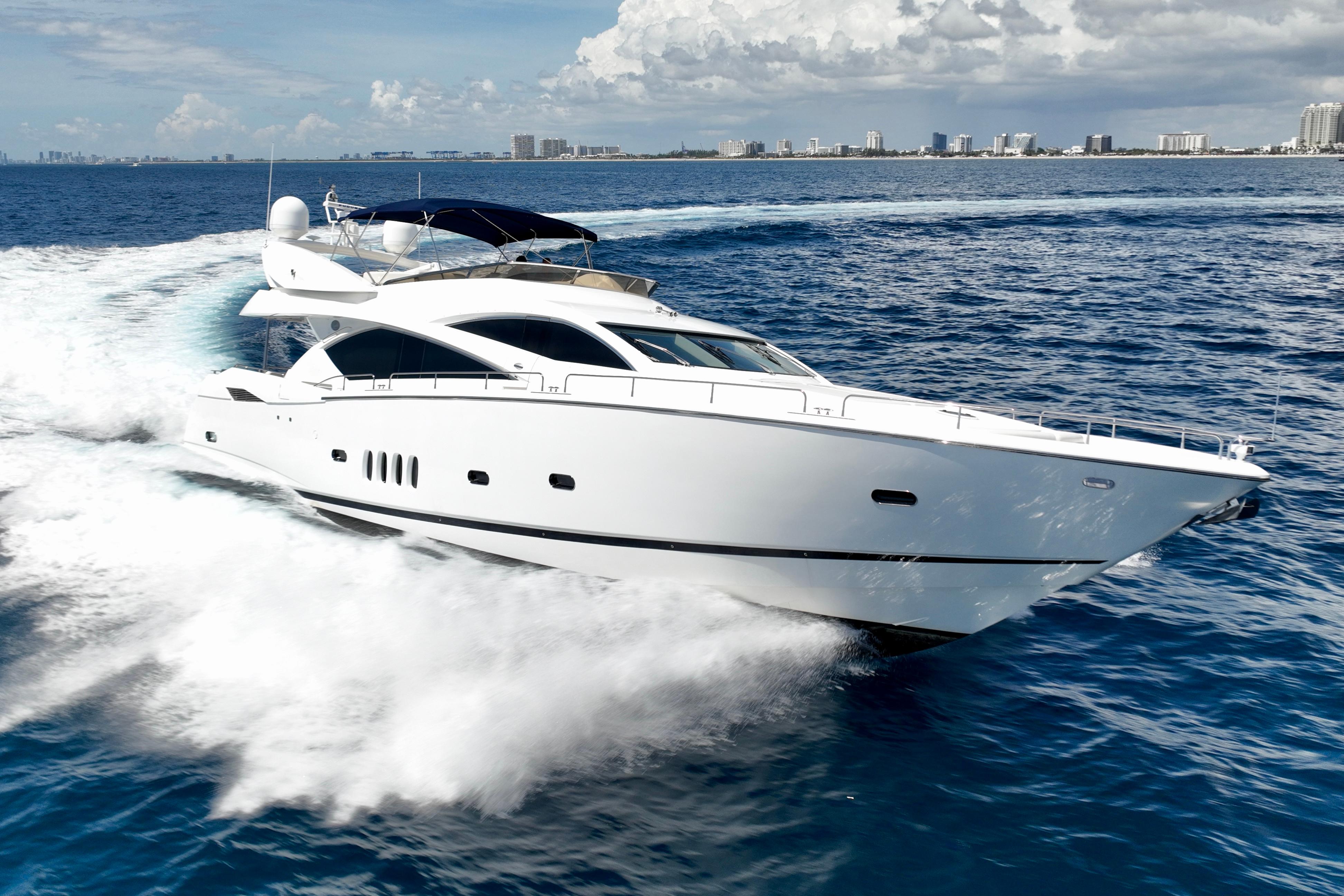 Sunseeker 82 Yacht 2005 Sunseeker 82 Yacht cruising on open water, city skyline in background.