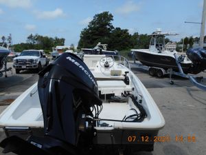 Boston Whaler 150 Super Sport 2010 Boston Whaler 150 Super Sport with Mercury engine, parked at a marina.