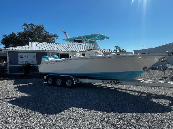 Key West 263 FS 2024 Key West 263 FS boat on trailer outside marine dealership.