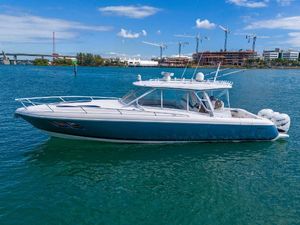 Intrepid 407 Cuddy 2019 Intrepid 407 Cuddy boat on blue water with cityscape background.