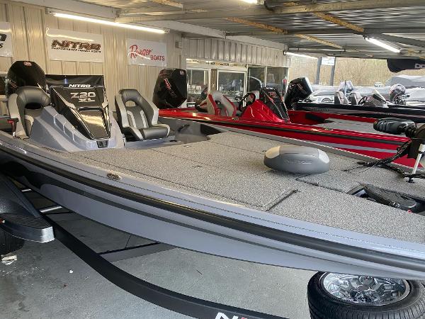 Nitro Z20 XL Pro 2025 Nitro Z20 XL Pro bass boat in showroom, featuring sleek design and modern seating.