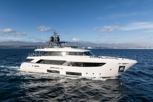 Custom Line Navetta 33 Luxurious 2021 Custom Line Navetta 33 yacht cruising on open sea under clear skies.