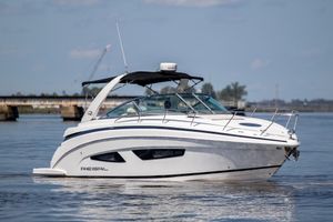 Regal 32 Express 2017 Regal 32 Express boat cruising on calm water, showcasing sleek design and modern features.