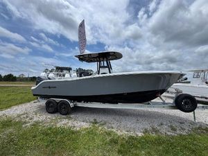 NauticStar 292 Legacy 2025 NauticStar 292 Legacy boat on trailer under cloudy sky.