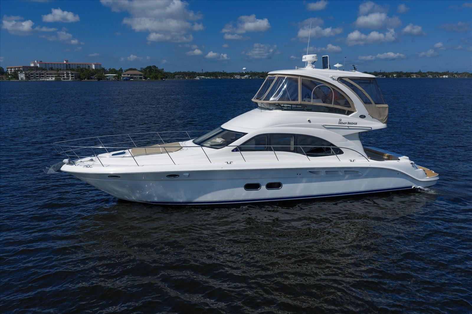 Sea Ray 52 Sedan Bridge 2007 Sea Ray 52 Sedan Bridge yacht on calm water under a blue sky.