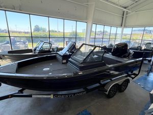 Crestliner 2050 Fish Hawk 2025 Crestliner 2050 Fish Hawk boat displayed in a showroom, featuring sleek design and modern amenities.
