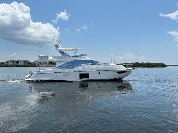 Azimut 55 Motor Yacht 2019 Azimut 55 Motor Yacht cruising on calm waters under a clear sky.