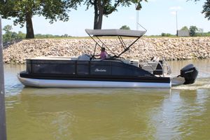 Barletta Aria 24CC 2024 Barletta Aria 24CC pontoon boat cruising on a calm river.