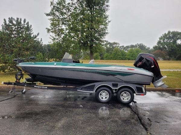 Ranger 2080MS 2024 Ranger 2080MS boat on trailer, parked outdoors on a rainy day.