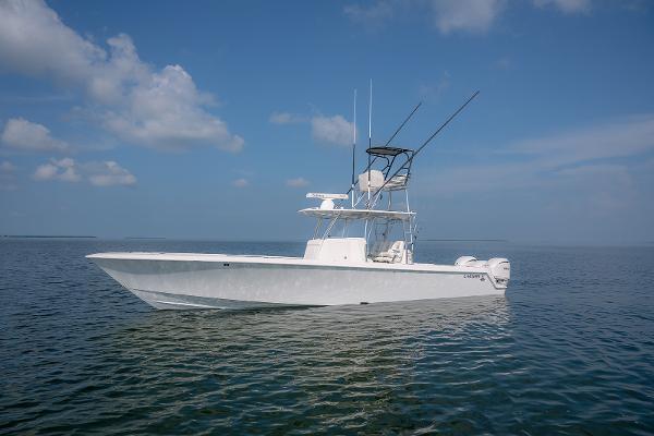 Contender 39 ST 39ST 2022 Contender 39 ST boat on calm ocean waters under blue sky.