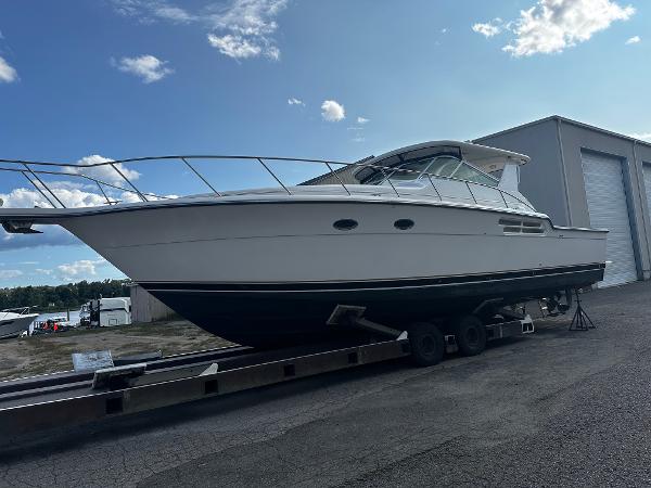 Tiara Yachts 43 Open 1999 Tiara Yachts 43 Open on trailer, parked outdoors under a clear sky.