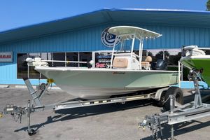 Sportsman Masters 227 Bay Boat 2019 Sportsman Masters 227 Bay Boat on trailer outside a blue building.