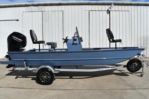 Lowe Roughneck RX1860 CC 2025 Lowe Roughneck RX1860 CC boat on trailer, blue exterior, Mercury engine, parked outdoors.