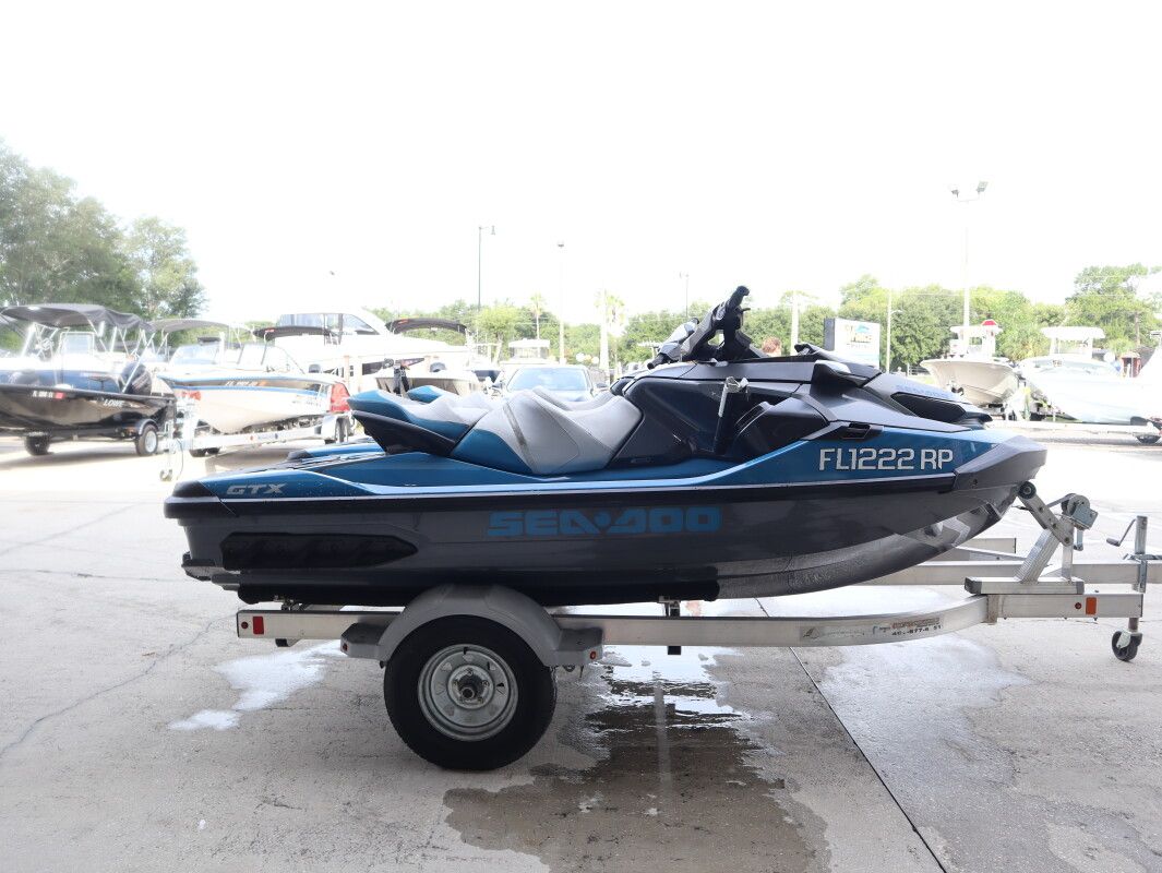 Sea-Doo GTX 155 2018 Sea-Doo 155 GTX jet ski on trailer, parked in marina.