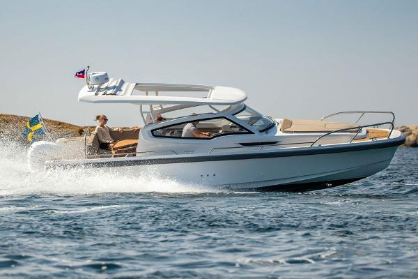 Nimbus W9 2025 Nimbus W9 motorboat cruising on open water.