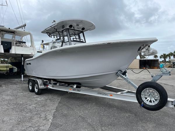 Sea Pro 262 Sport 2025 Sea Pro 262 Sport boat on trailer, parked outdoors.