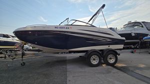 Hurricane SunDeck 191 OB 2022 Hurricane SunDeck 191 OB boat on trailer, parked outdoors under clear sky.