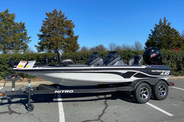 Nitro Z18 2024 Nitro Z18 boat on trailer in parking lot, clear sky background.